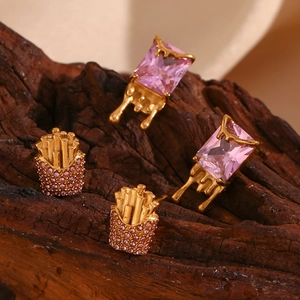 Detail of gold-plated rectangle earrings and French fries studs with pink crystals