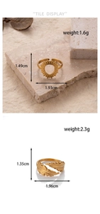 Detailed view of adjustable golden sun and feather rings with weight and size measurements