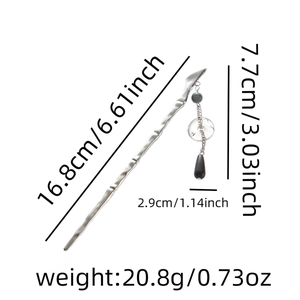 Detailed view of wave-textured hair pin with tassel and measurement specifications