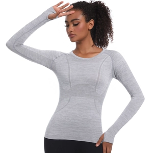 Close-up of seamless knitted texture and functional thumbholes on long sleeve sports top