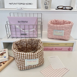 Quilted plaid fabric storage baskets in brown and pink colors for desktop organizing