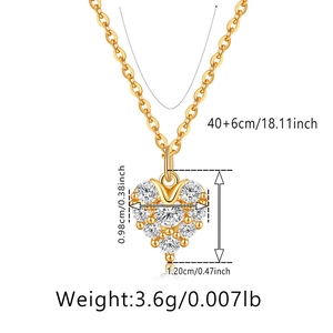 Detail view of heart pendant necklace with clear cubic zirconia pavé and gold chain