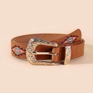 Detail of brown leather belt with ethnic embroidery and ornate gold-toned buckle