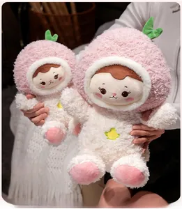 Detail of soft peach plush dolls with pink faux fur and star embroidery in two sizes