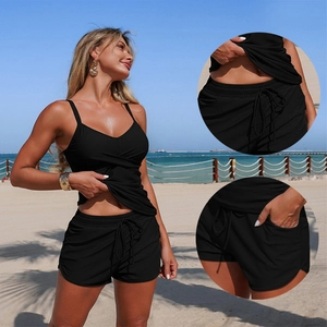Women's black two-piece tankini set featuring V-neck top and drawstring swim shorts with pockets