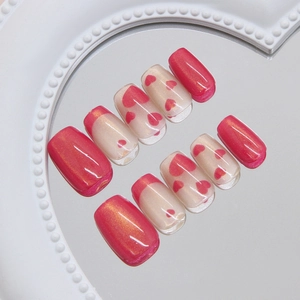 Pink cat-eye heart press-on nails with French design in medium long square shape
