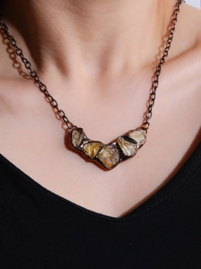 Vintage statement necklace featuring raw citrine stones and antique copper chain links