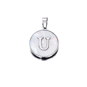 Detailed macro view of retro stainless steel letter U pendant with mother of pearl inlay