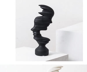 Close-up of matte black abstract sculpture showing detailed frosted grain and layered design