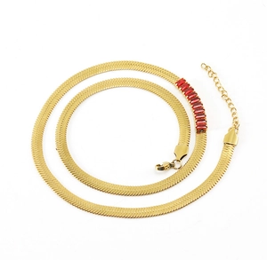Detail of 18K gold stainless steel snake chain necklace with red rectangular gemstones