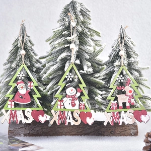 Three wooden Christmas tree ornaments with Santa, Snowman and Reindeer painted patterns
