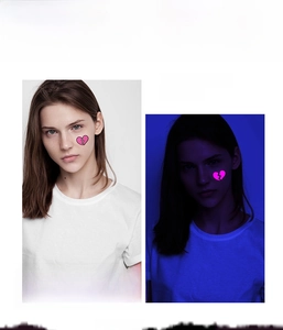 Detailed UV glow neon heart tattoo sticker effect comparison in daylight and dark