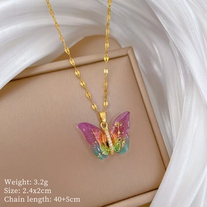 Detail view of butterfly necklace with size 2.4x2cm and weight 3.2g specifications