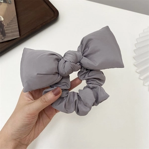 Morandi grey fabric scrunchie with large bow knot and soft pleated cotton texture