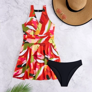 Detail of floral tankini top with tropical leaf print and black bikini bottoms
