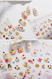 Macro view of 5D embossed nail stickers featuring cute cartoon animals and fruit patterns