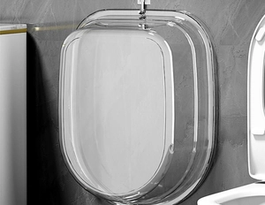 Transparent wall-mounted laundry basin in PET plastic on grey stone bathroom wall