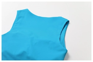 Detail shot of bright blue athletic tank top showing high-quality stitching and round neckline