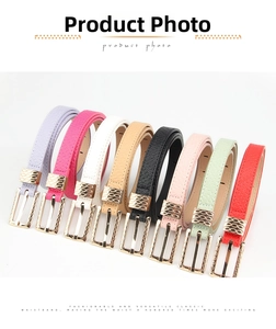 Collection of colorful slim leather belts with gold rectangular buckles on white background