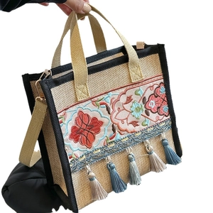 Ethnic embroidery tote bag in beige canvas with floral patterns and colorful tassels