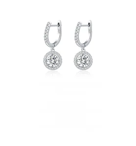 Macro detail of S925 sterling silver stamp and sparkling halo round moissanite earring