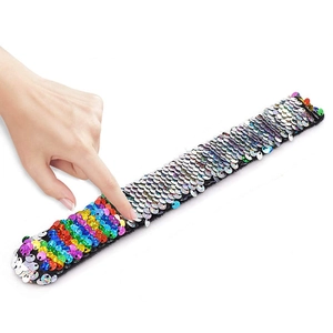 Colorful mermaid sequin slap bracelet for kids showing reversible flip effect on wrist