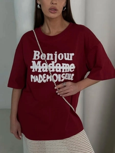 Detail of burgundy cotton t-shirt with Bonjour Madame Mademoiselle embroidery on the front
