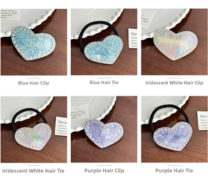 Detail of heart-shaped rhinestone acetate hair clips and ties in blue, white, and purple