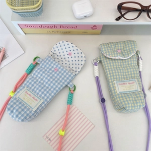 Quilted checkered camera pouches with snap button closure and woven adjustable lanyard