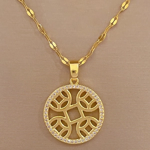 Macro detail of gold-plated titanium necklace with micro-paved crystal coin pendant