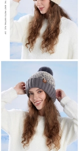 Close-up of winter knit beanie with pom pom detailing and soft fleece lining texture