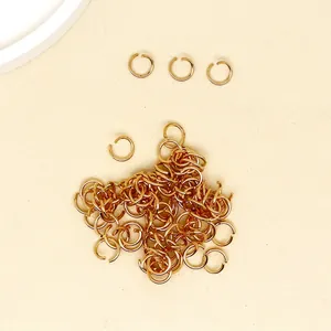 Detailed view of golden 9x7mm jump rings set for DIY jewelry and keychain making
