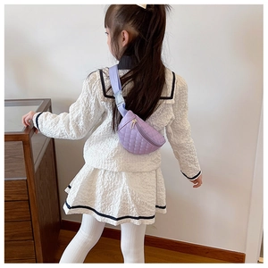 Close-up of child wearing a purple quilted PU leather waist bag with adjustable strap