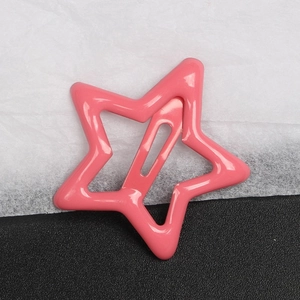 Pink star-shaped Y2K BB hair clip with candy color lacquer finish on textured background