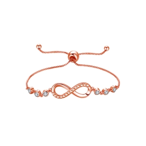 Macro view of adjustable rose gold infinity bracelet with zircons and box chain detail