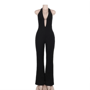 Macro detail of sexy black lace jumpsuit featuring halter neck and deep V-neck design