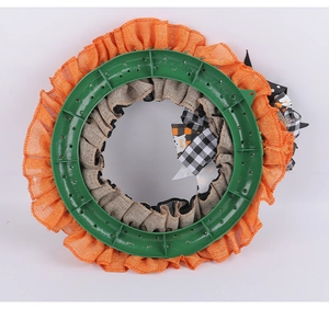 Detailed back view of Halloween ghost wreath showing orange burlap and green plastic frame