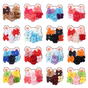 Colorful 16-set children hair accessories with bows and flowers on bear cardboards