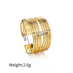 Detailed view of wide multi-layer gold hammered ring showing dimensions 2cm by 1.2cm