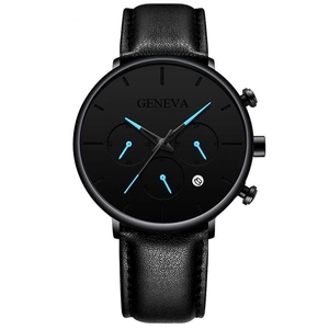 Detail of black leather watch strap and dial with date window and blue hands