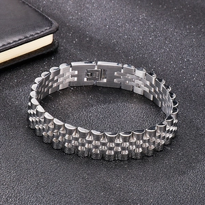 Macro detail of 15mm stainless steel watch strap style bracelet with fold-over safety clasp