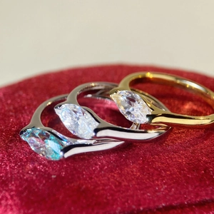 Macro shot of 925 silver rings with marquise cut stones on a velvet background