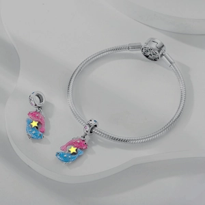 Detail of S925 silver snake chain bracelet featuring blue enamel Pisces zodiac charms