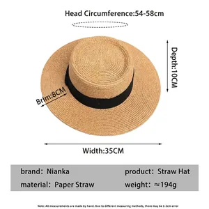 Flat top straw sun hat with black ribbon and specific size measurements for beach wear