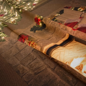 Detailed texture of Christmas tapestry fabric showing festive prints and soft material