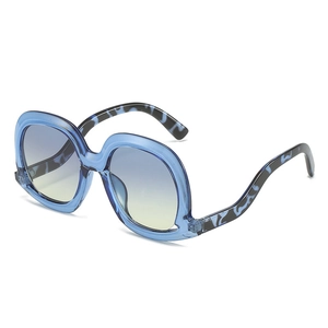 Fashionable oversized blue sunglasses with gradient lenses in a 45-degree professional view