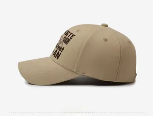 Close-up of khaki baseball cap featuring intricate side embroidery and breathable eyelets