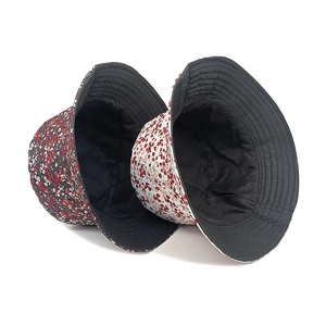 Floral print reversible bucket hats in black and white styles for sun protection