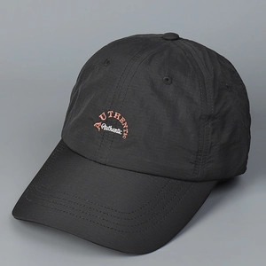 Close-up of orange Authentic embroidery on black quick-dry nylon baseball cap