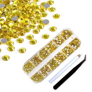 Detailed set of yellow flatback nail rhinestones with picking pen and tweezers tools